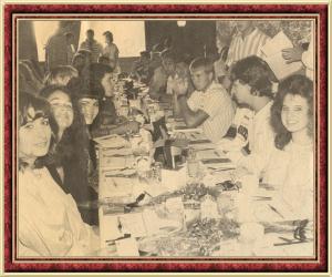 Grads sitting down to a parent-served breakfast