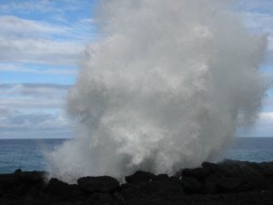 Wave crashing up thru a lava tube