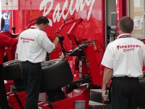 Tires being mounted by the Firestone Racing crew