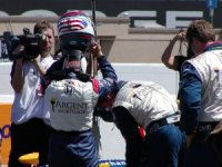 Danica Patrick putting on her helmet